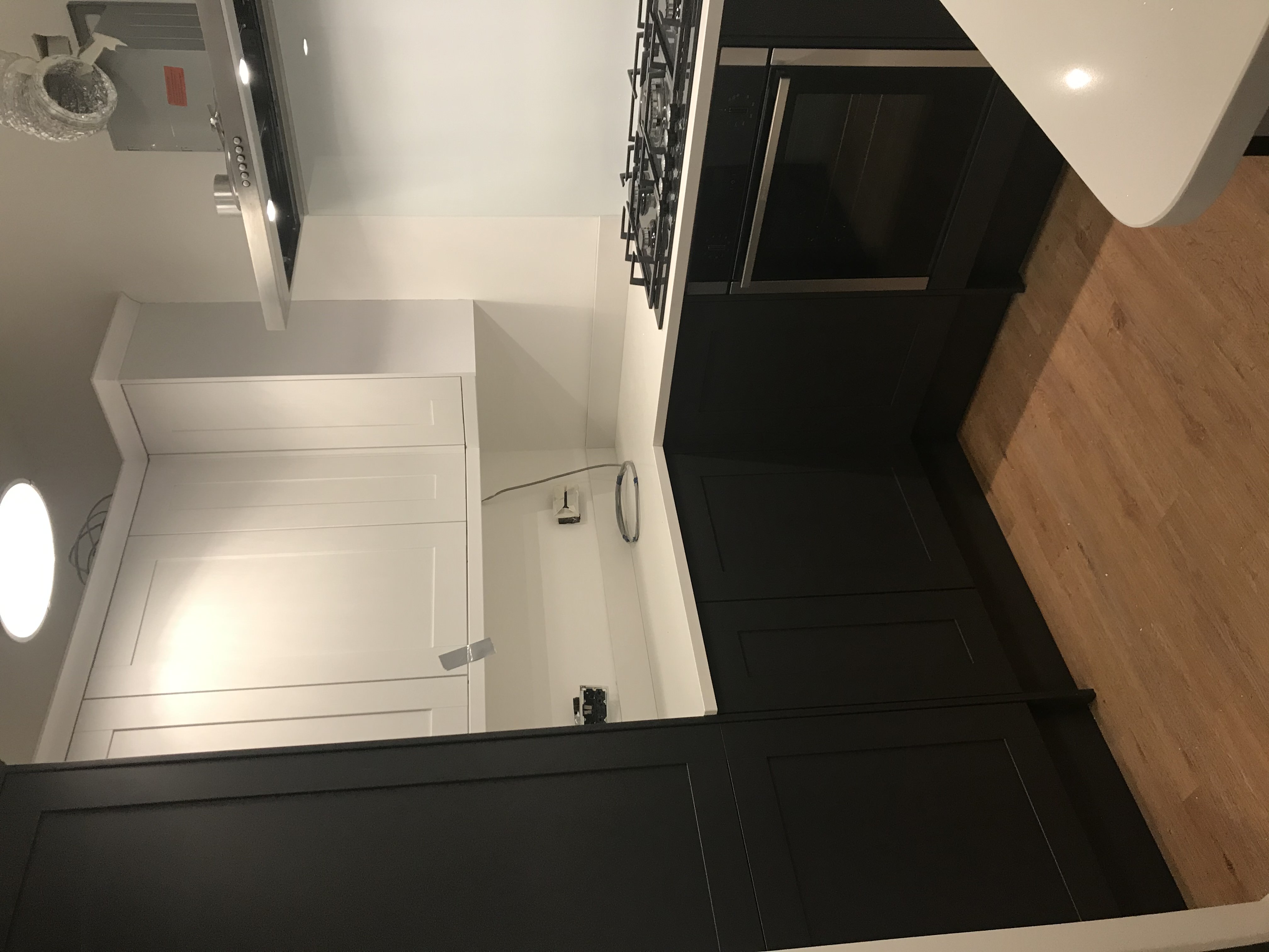 Beautifully finished dark kitchen installed by Claremont Build & Co