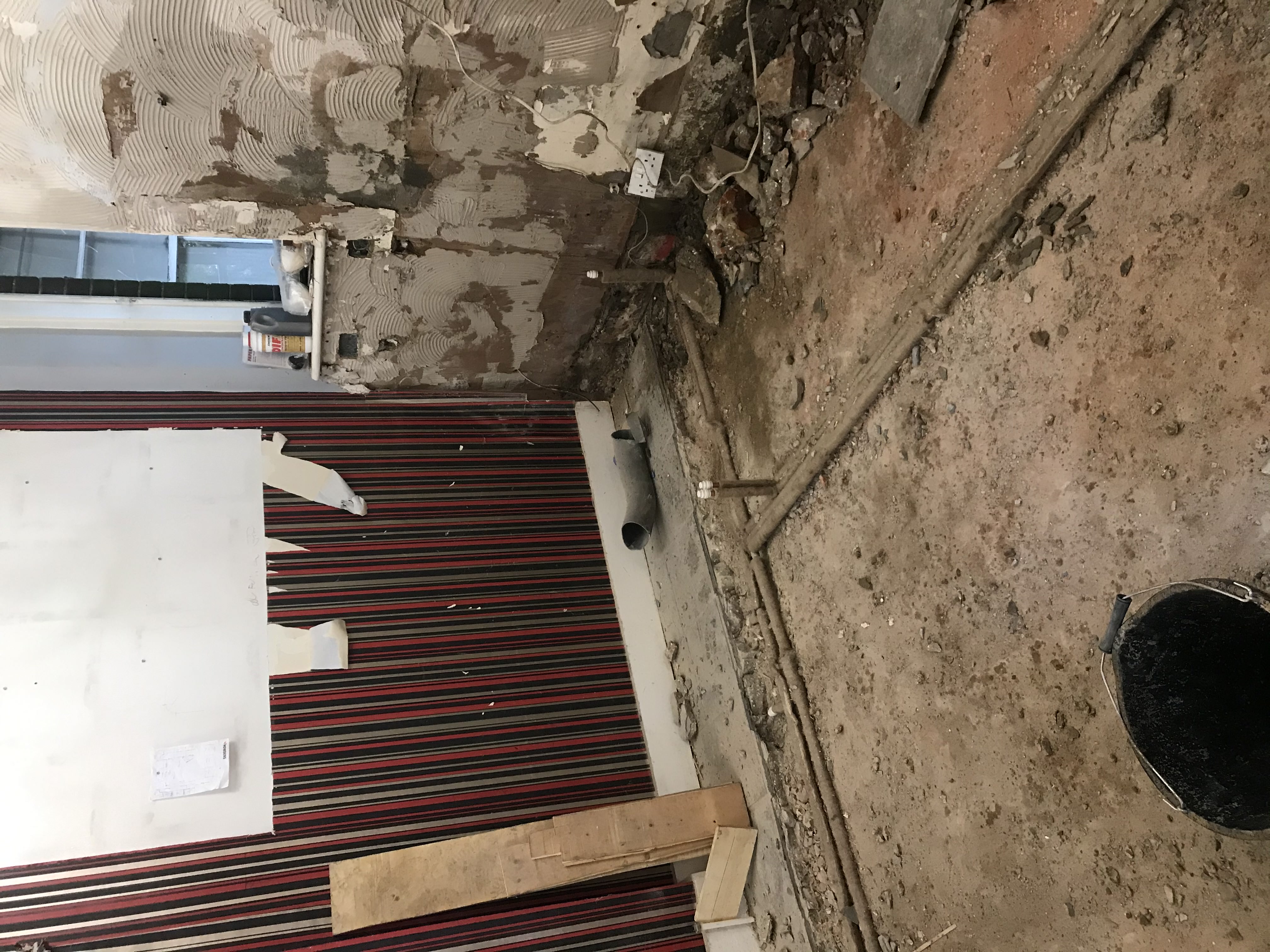 Kitchen stripped back before structural work by Claremont Build & Co