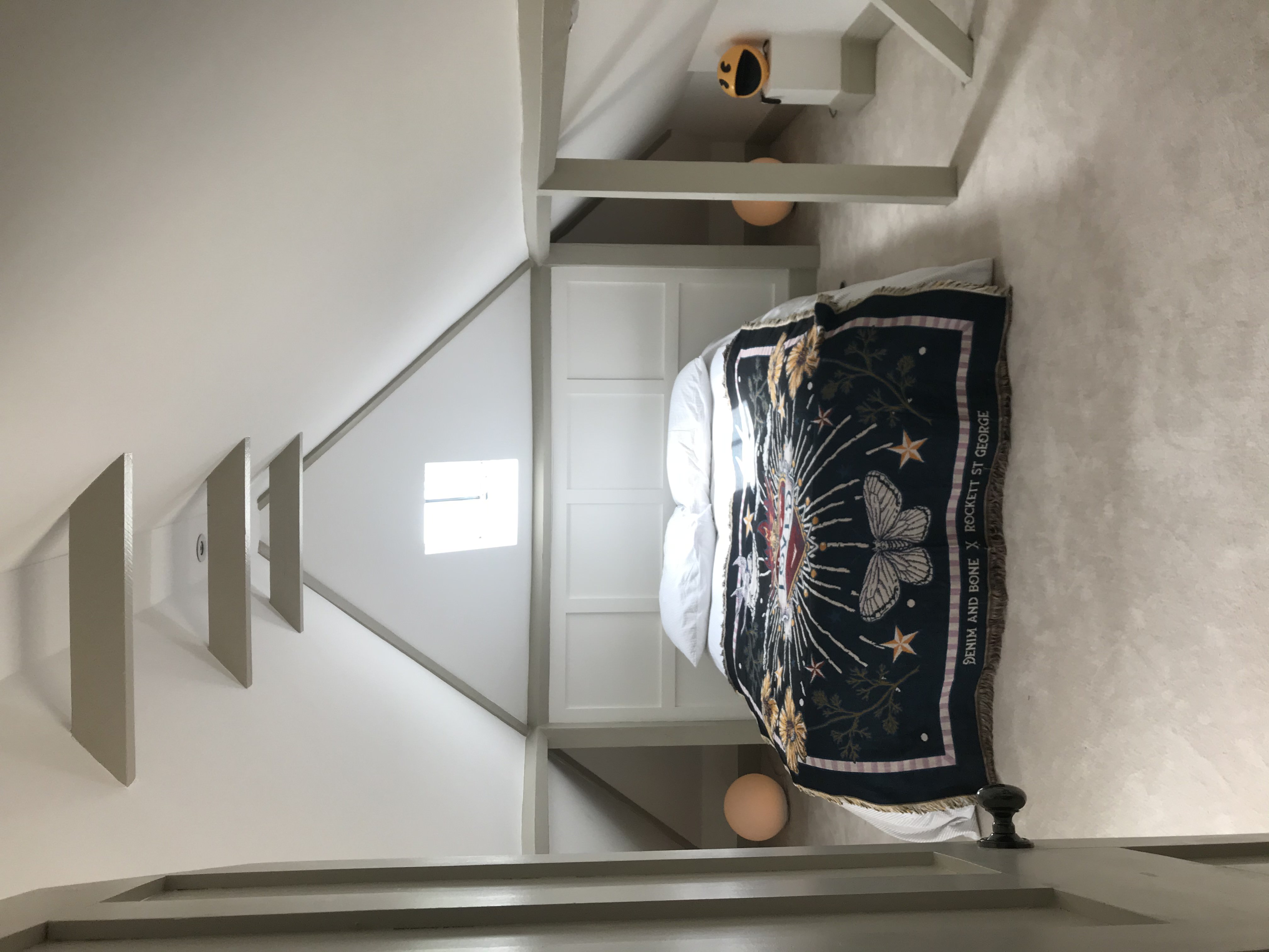 Finished loft bedroom conversion by Claremont Build & Co